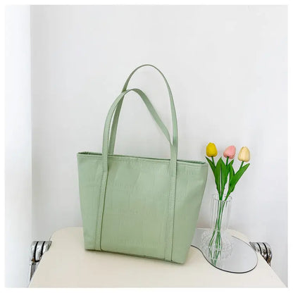 Bolso grande de verano para mujer Nueva versión coreana Bolso de hombro casual de gran capacidad Textura Bolso de mano de color sólido eprolo