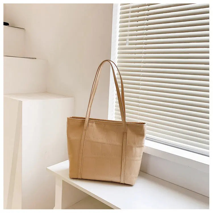 Bolso grande de verano para mujer Nueva versión coreana Bolso de hombro casual de gran capacidad Textura Bolso de mano de color sólido eprolo